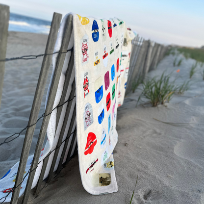 beach badge blanket on dune fence on the jersey shore