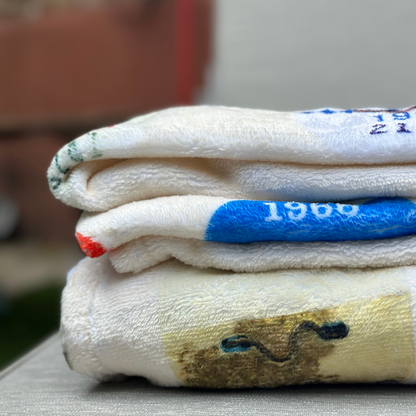 beach badge blanket folded in backyard