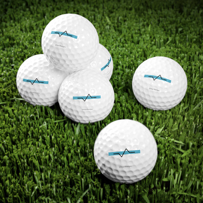 6 beach badge golf balls on grass